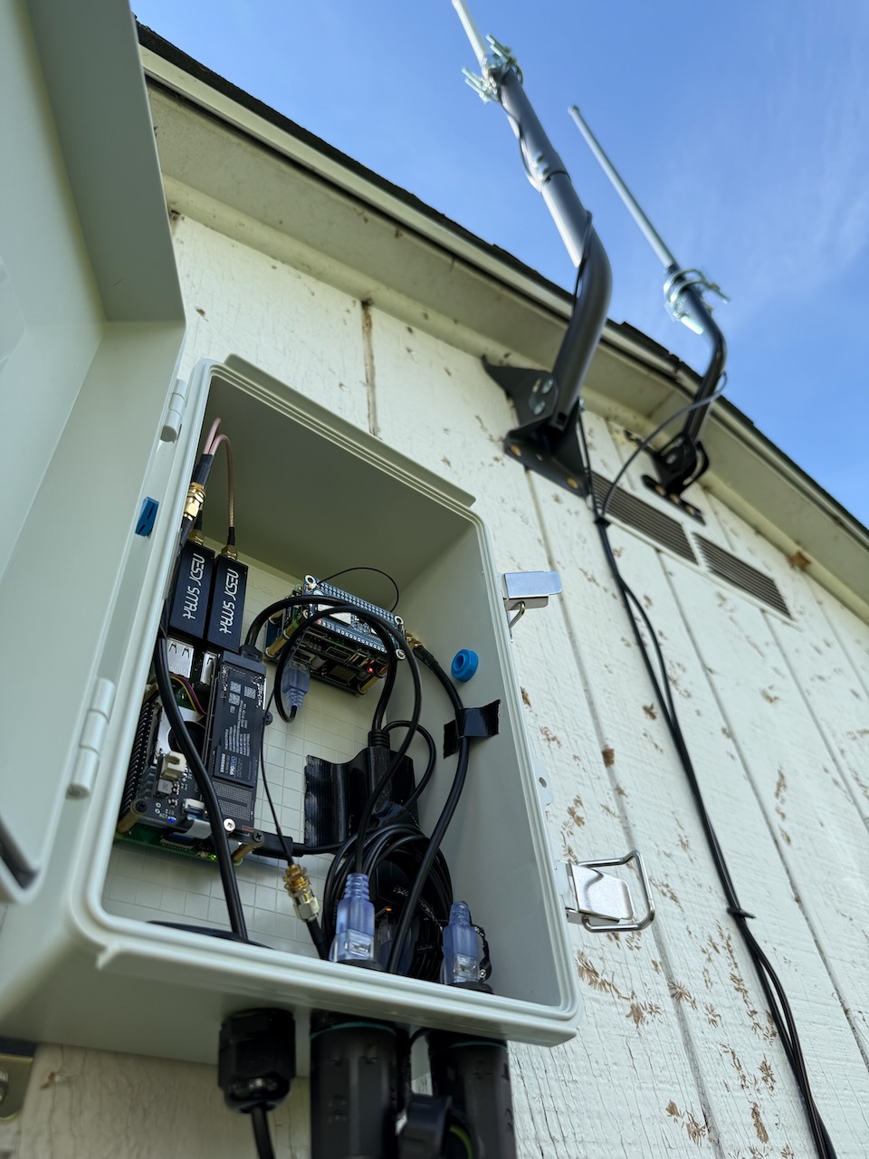 Outdoor enclosure open with antennas